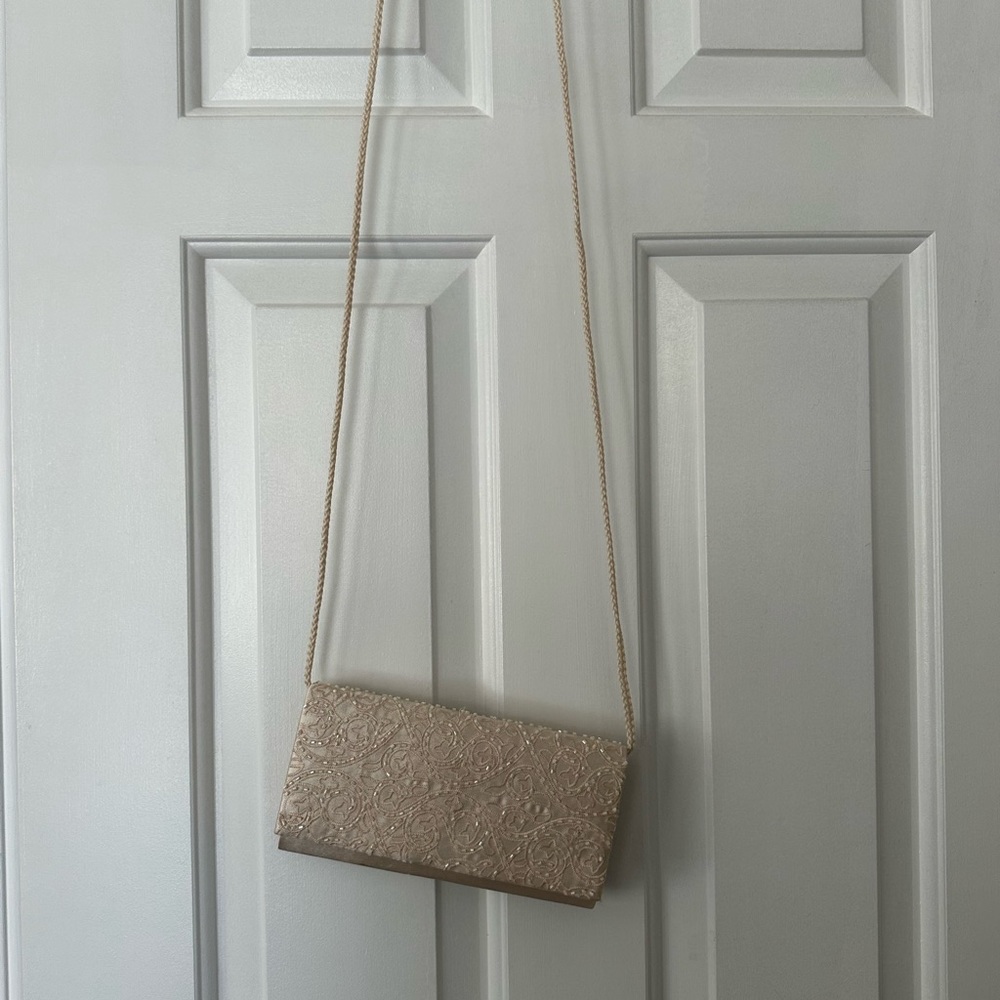 Ivory clutch with strap